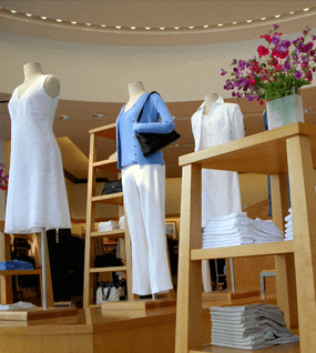 Retail store with mannequins dressed in blue and white clothing